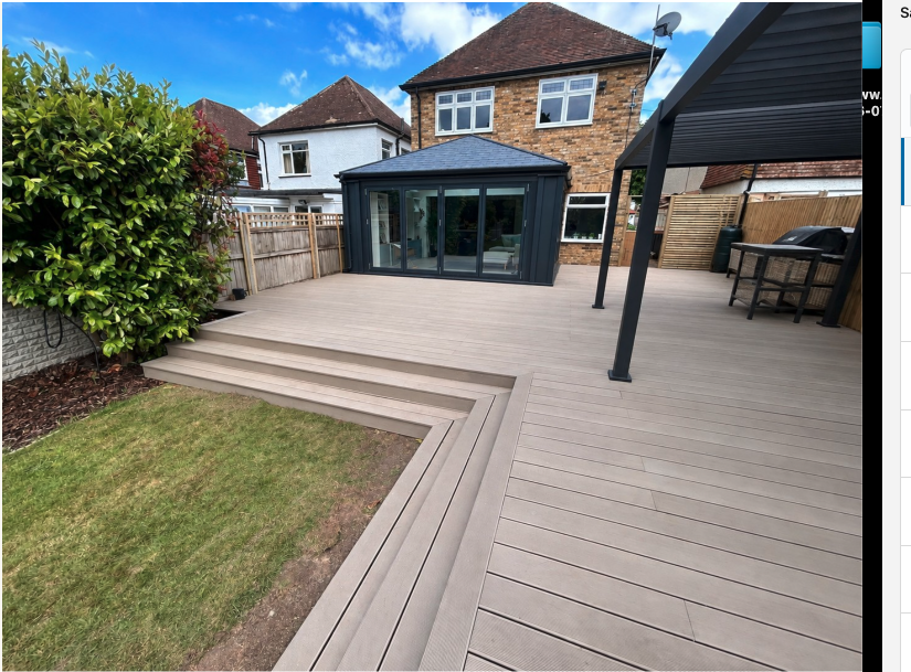 Sittingbourne composite garden deck with broad steps and a covered seating area