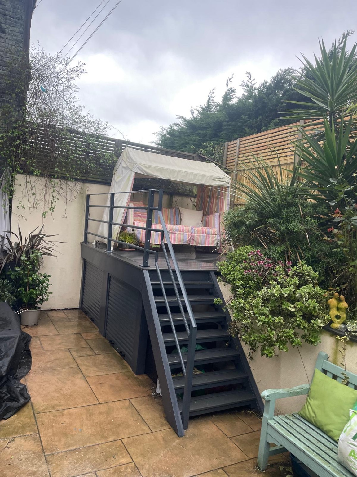 A raised composite deck with storage underneath