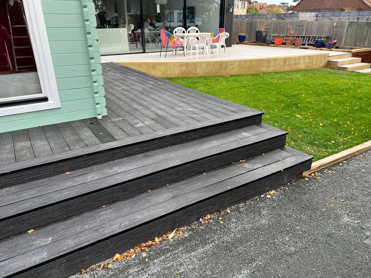 The wraparound deck beside the lawn